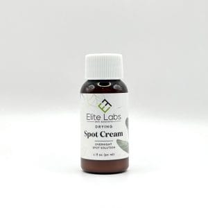 A bottle of Drying Spot Cream set against a white background.
